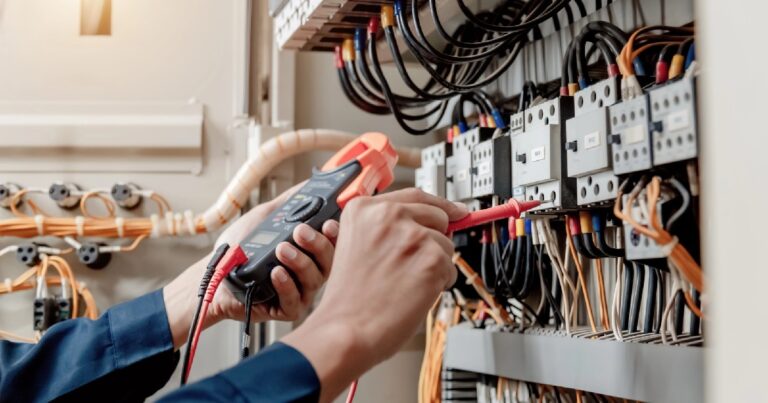 Electrician working on switchboard