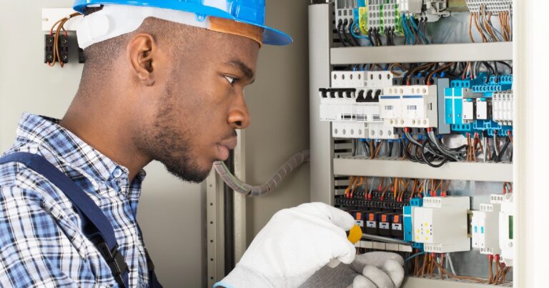 African American electrician at work